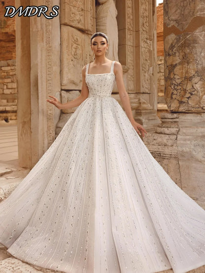 Sexy Spaghetti Strap Bridal Gown 2026 Graceful Sleeveless Wedding Dress Shiny A-Line Beaded Sequin Floor-Length Gown Customized